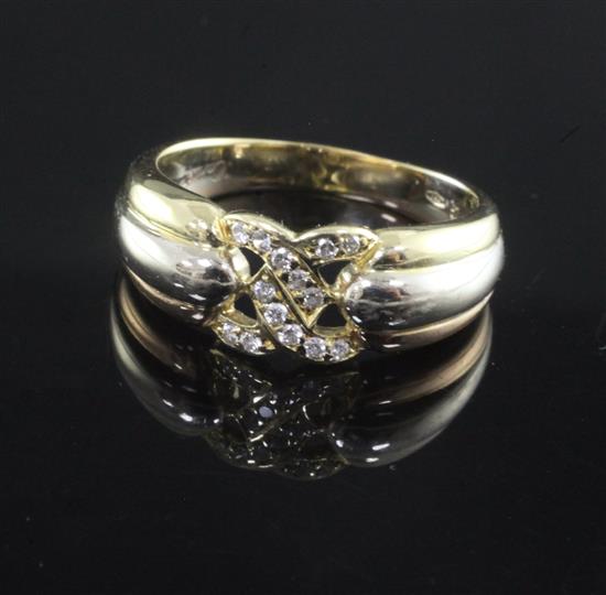 A 1980s Cartier three colour gold and diamond set ring, size O.